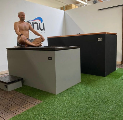 Man practicing breathwork before entering RENU Therapy cold plunge tank