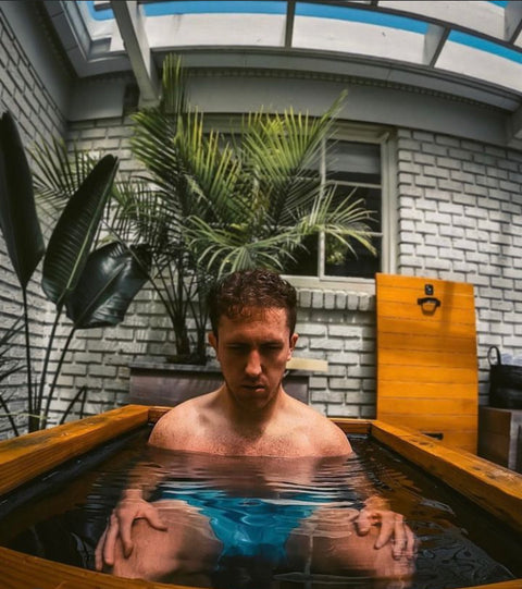 Man sitting in RENU Therapy cold plunge pool